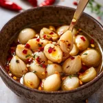 Konfierter Knoblauch mit Chiliflocken First Image First Image